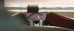 Still from the film Nowhere Place. It is a close-up of a typewriter.