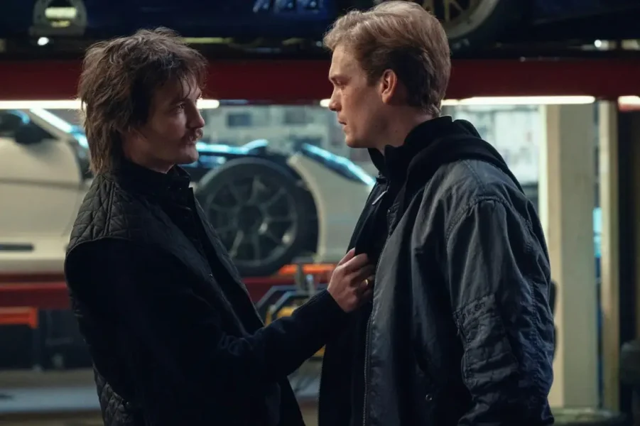Still from Safe Harbor. Marco and Farrell are facing each other in a car garage.